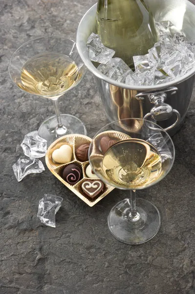 Two glasses, bottle of champagne and chocolate. Valentines Day — Stock Photo, Image