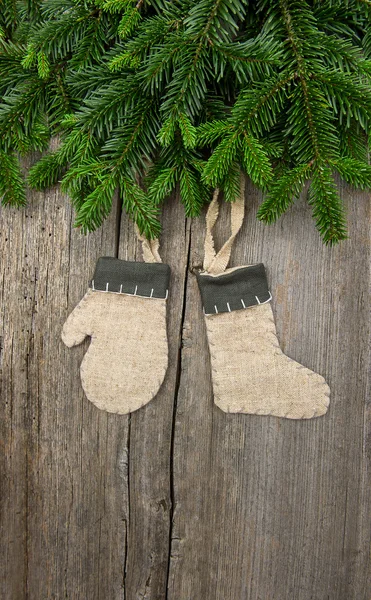 Christmas tree branch over wooden background — Stock Photo, Image