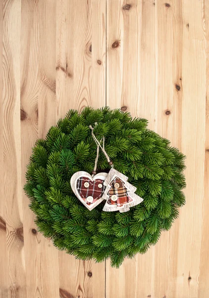 Traditional christmas wreath on wooden background — Stock Photo, Image