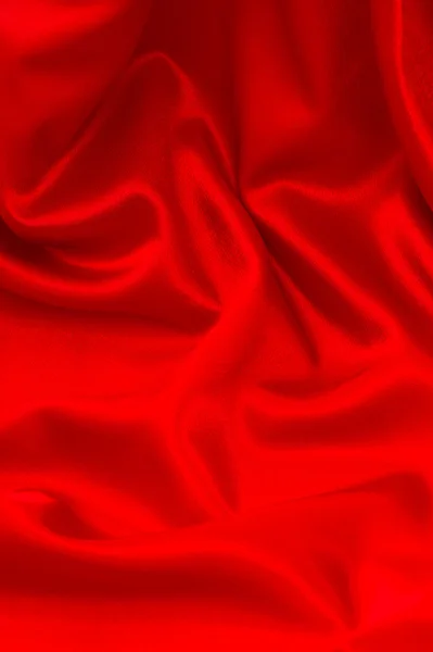 Fundo de tecido de cetim vermelho brilhante — Fotografia de Stock