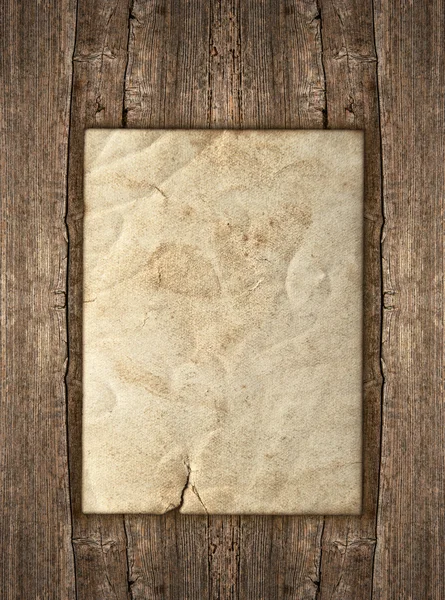 Old paper sheet over rustic wooden background — Stock Photo, Image