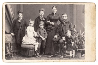 Old family photo. parents with five children clipart