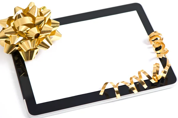 Tablet pc golden bow and ribbon decoration — Stock Photo, Image