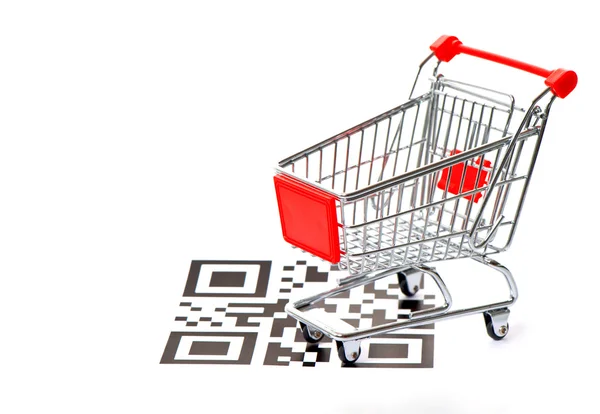 Shopping koncept med qr koden och vagn — Stockfoto