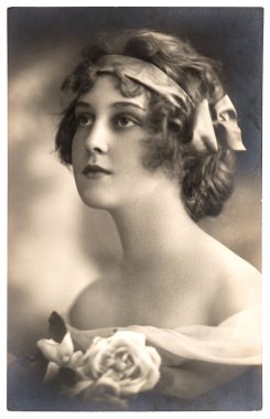 Portrait of young woman with rose flowers