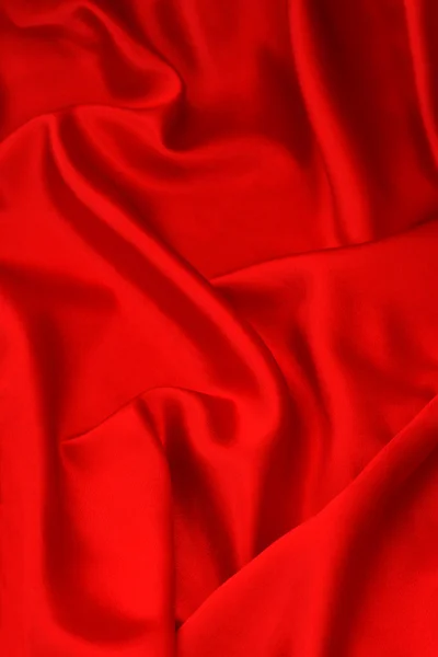 Fundo de tecido de cetim vermelho brilhante — Fotografia de Stock