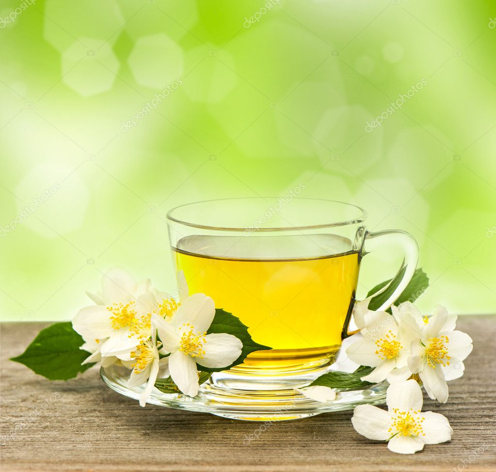 Cup of tea with jasmine flowers Stock Photo by ©LiliGraphie 21855833