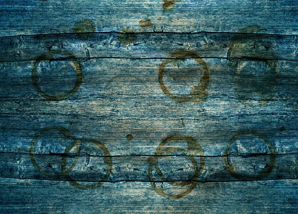 rustic blue wooden background with stains