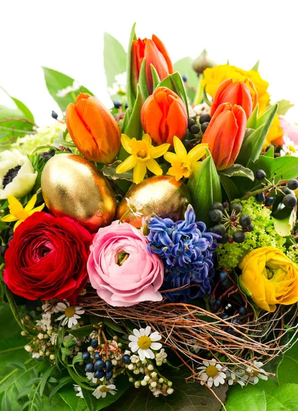 Closeup of colorful easter bouquet with golden eggs — Stock Photo, Image