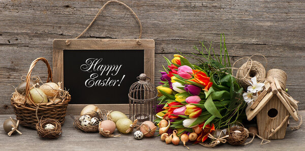 Vintage easter decoration with eggs and tulip flowers Stock Photo