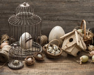 vintage easter decoration with eggs, birdhouse and birdcage clipart
