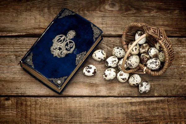 Decoration with eggs and antique bible book — Stock Photo, Image
