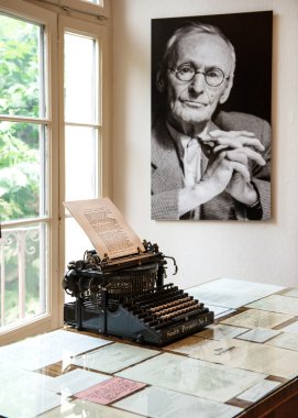 Portrait and original typewriter in Herman Hesse museum clipart