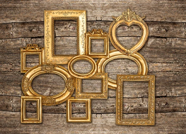 Antique golden framework rustic wooden wall — Stock Photo, Image