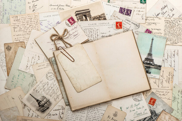 Open empty diary book, old letters, french postcards. scrapbook