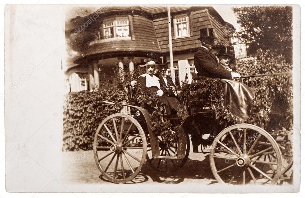 Original antique photo with people wearing vintage clothing