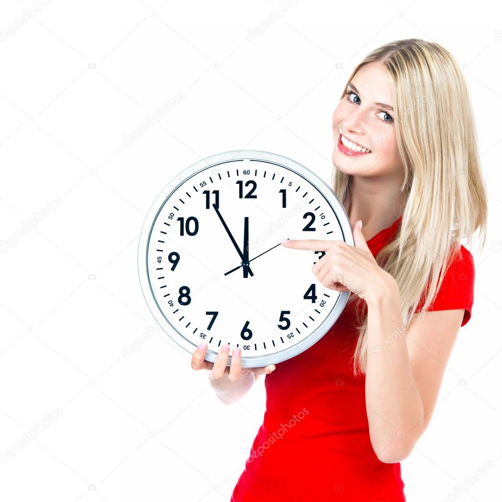 Time concept. five to twelve. young beautiful woman with big clo