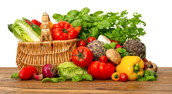Färska grönsaker och örter på vit bakgrund — Stockfoto
