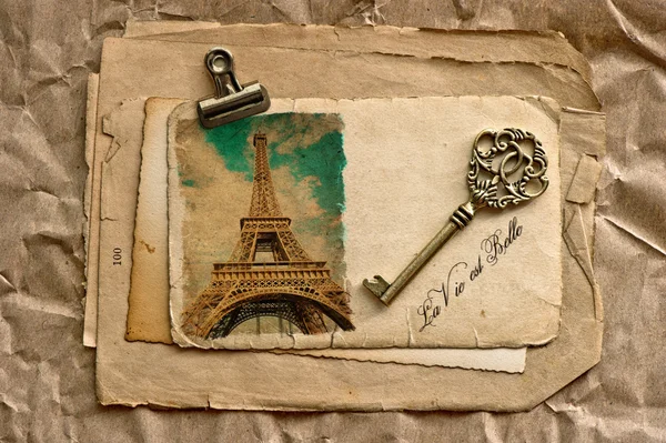 Old paper sheets with clip and vintage key — Stock Photo, Image