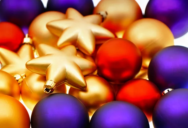 Lila, red and golden baubles — Stock Photo, Image