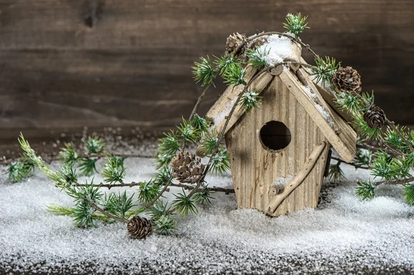 Birdhouse and christmas tree brunch decoration — Stock Photo, Image