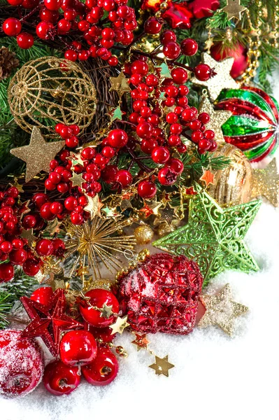 Baubles, golden garlands, christmas tree and red berries — Stock Photo, Image