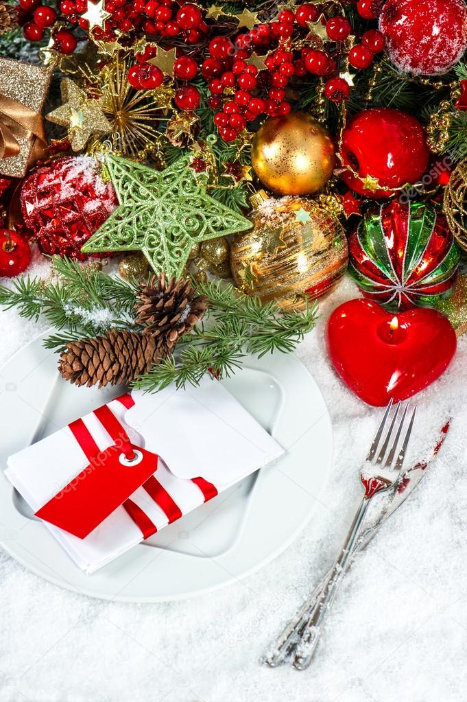 Christmas table place setting with red heart candle