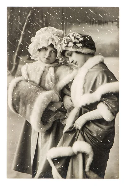 Two young girls in vintage winter clothing. christmas postcard — Stock Photo, Image