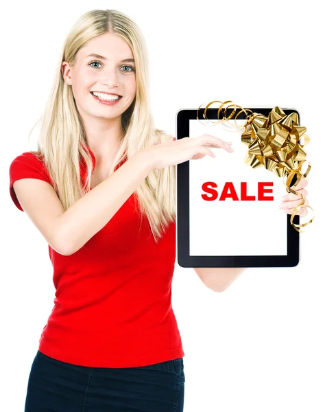 Woman with tablet PC and gift ribbon bow decoration — Stock Photo, Image