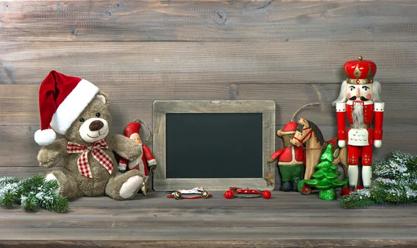 christmas decoration with antique toys and blackboard