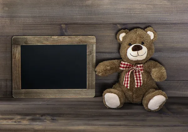 Vintage style still life with teddy bear and blackboard — Stock Photo, Image