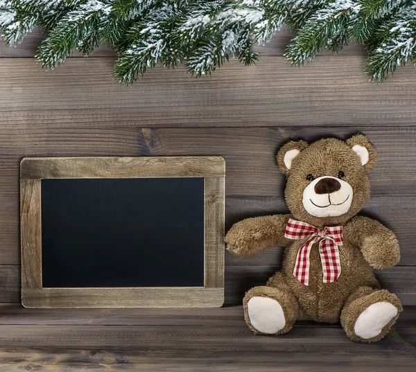 Christmas decoration with teddy bear and blackboard — Stock Photo, Image