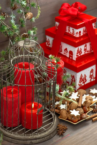 Christmas decorations, gift box, red candles, cookies — Stock Photo, Image