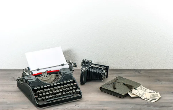 retro typewriter and vintage photo camera. antique objects