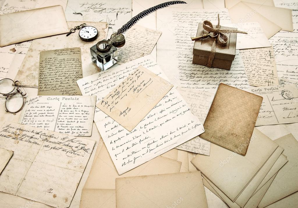 old letters, vintage postcards and antique feather pen