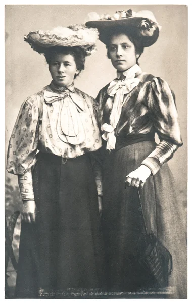 Two young ladies wearing vintage clothing — Stock Photo, Image