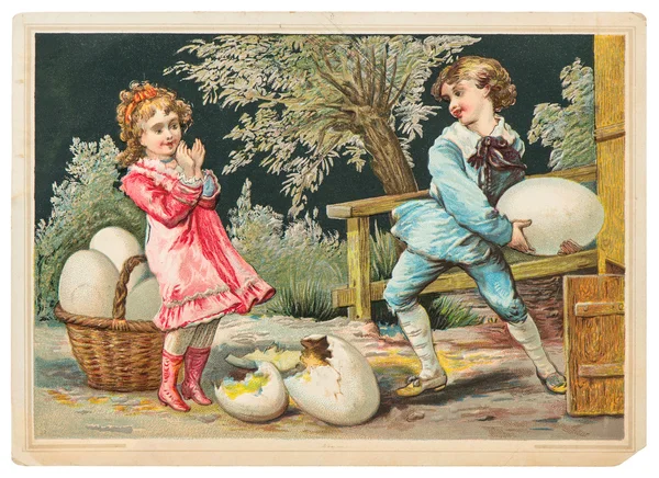 Niña y niño jugando con huevos de Pascua —  Fotos de Stock