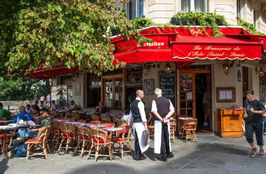 street scene in traditional Parisian cafe clipart