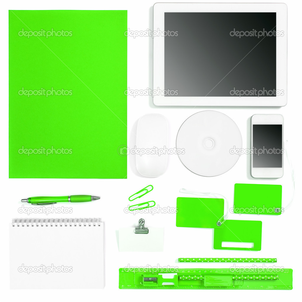 Set of green colored office tools over white