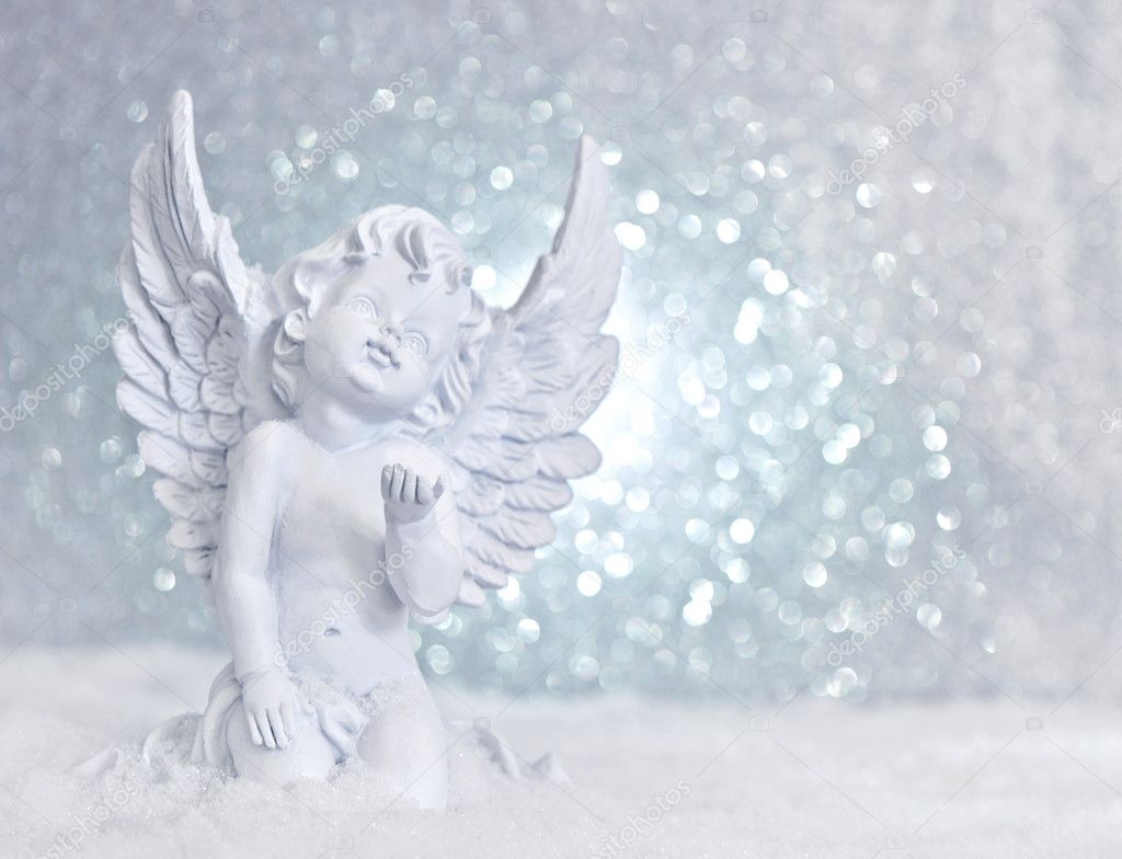 little white guardian angel in snow