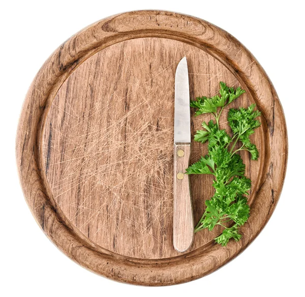 Färsk persilja ört och kök kniv på träskiva — Stockfoto