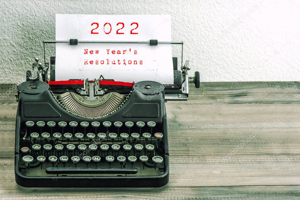 2022 New Years Resolutions. Vintage typewriter. Retro style toned picture