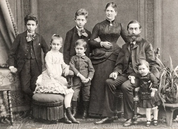 Old family photo. Parents with five children. Vintage picture Wien ca. 1900
