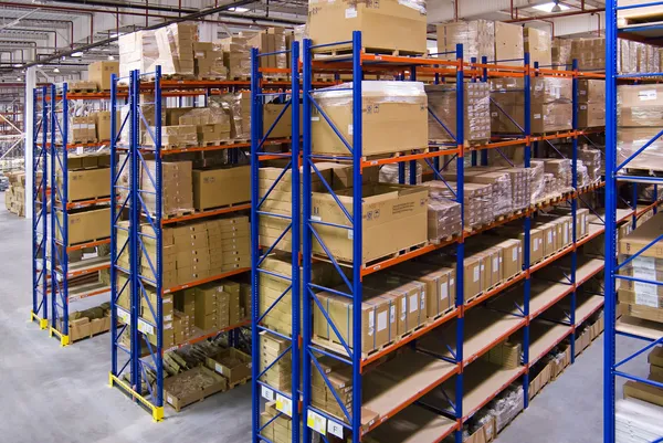 Warehouse with shelves and boxes Stock Image