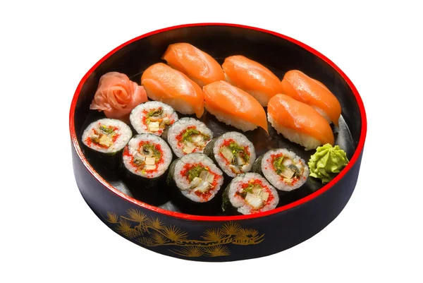 Nigiri sushi set in black round wooden plate — Stock Photo, Image