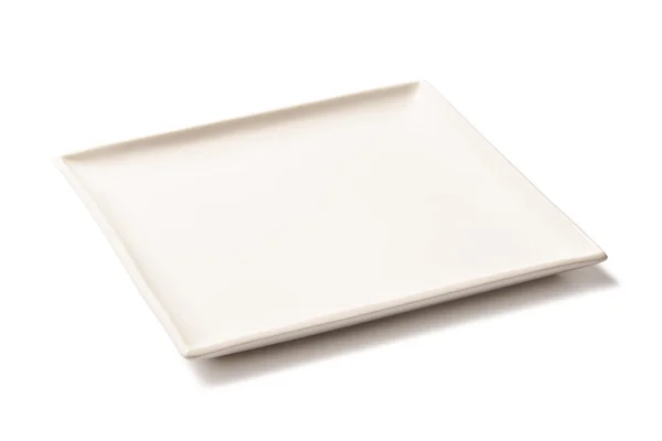 Placa rectangular vacía blanca de porcelana sobre un fondo blanco — Foto de Stock