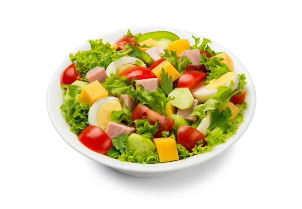 Chef salad with tomato, cucumber, lettuce, ham, bell pepper, cheese and eggs in a white bowl isolated on white background.
