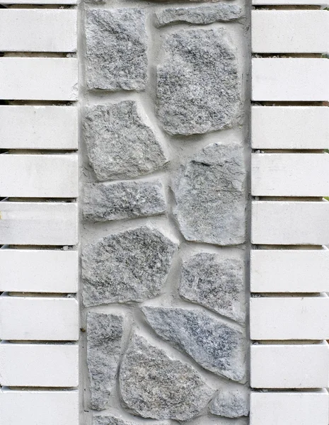 Wall composed of granite and brick — Stock Photo, Image