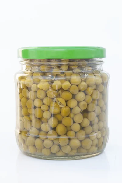 Canned green peas in glass jar Royalty Free Stock Photos