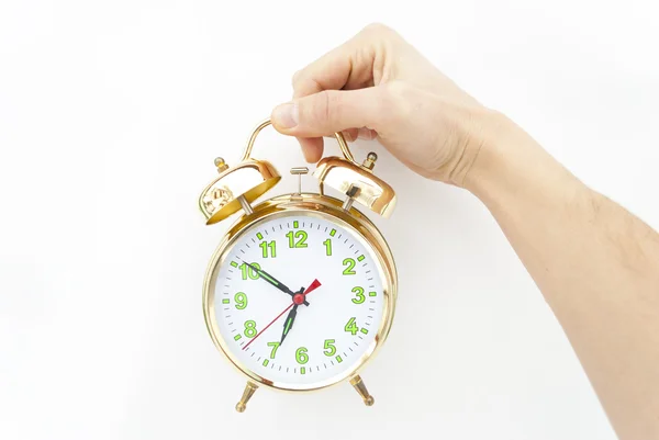 Alarm clock-egy kéz, egy fehér háttér — Stock Fotó